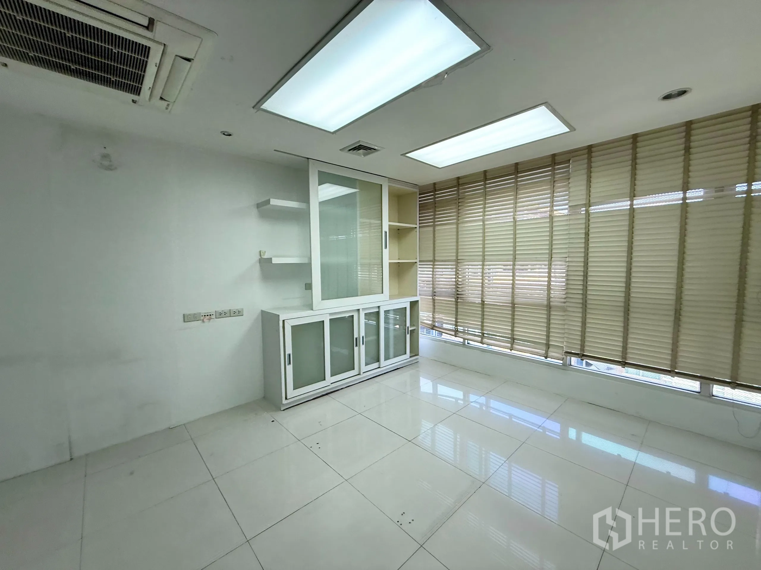 Office Space for rent in Bueng Kum, Bangkok - Office room with cabinets, shelving and window blinds.