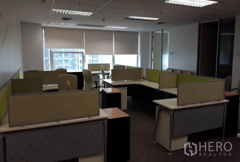 Office Space for rent in Bang Rak, Bangkok - Open-plan workspace with modular desks, task chairs and window blinds in a high-rise office.