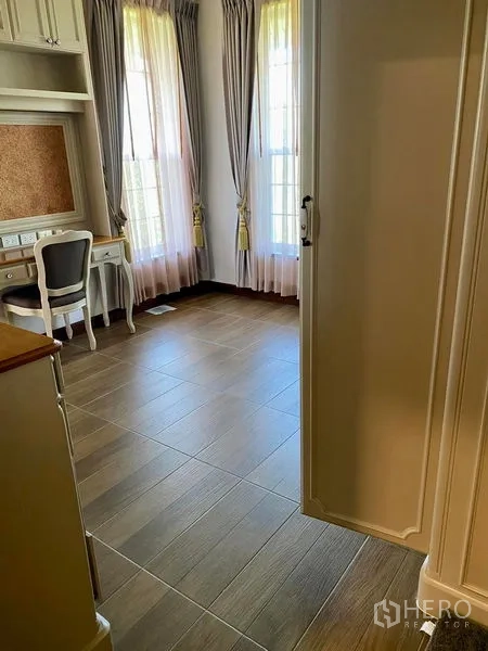 Detached House for sale in Bang Bo, Samut Prakan - Study nook with desk, large windows, and sheer curtains.