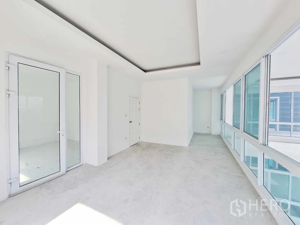 Office Space for sale in Bueng Kum, Bangkok - Upper-floor corridor with glass door and long window wall, ready to fit out.