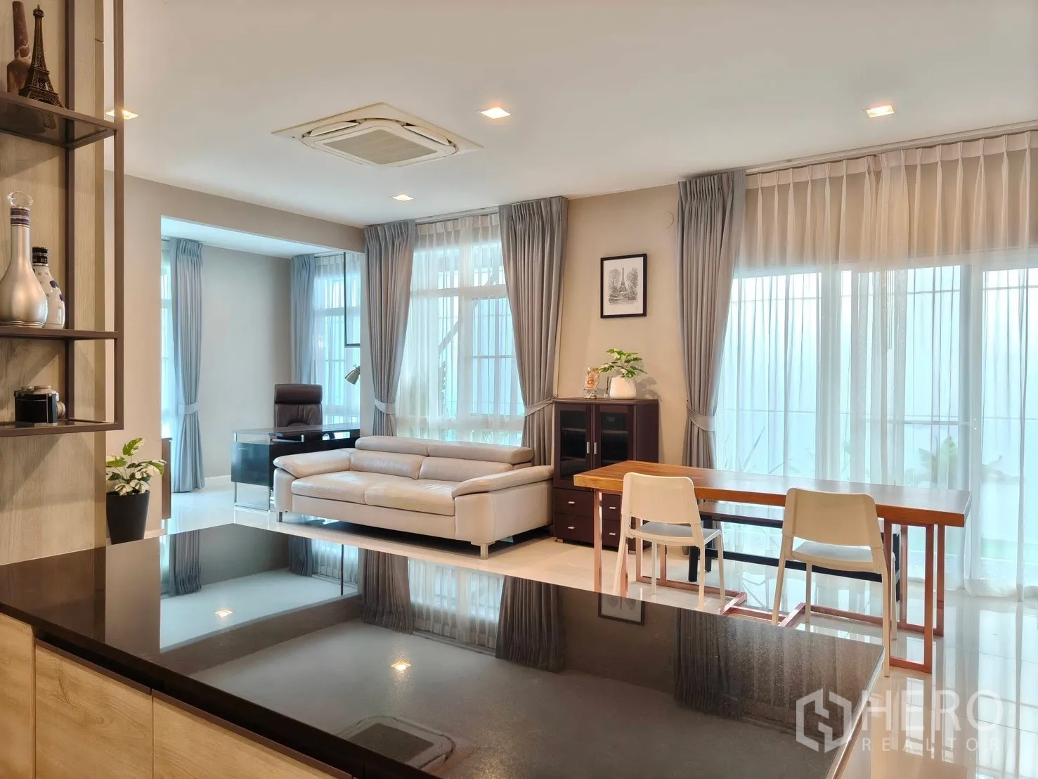 Detached House for rent or sale in Bang Phli, Samut Prakan - Two-storey house exterior with balcony, covered carport and landscaped front lawn.