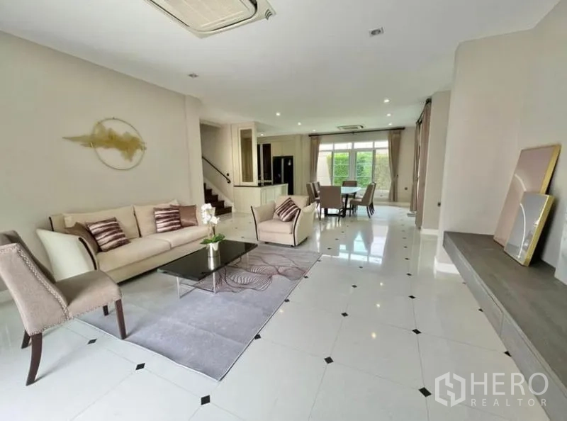 Detached House for rent in Bang Phli, Samut Prakan - Bright open living and dining room with tiled floors and garden outlook.
