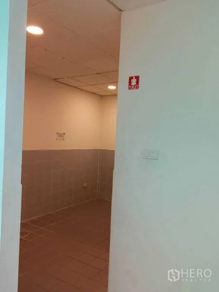 Office Space for rent in Huai Khwang, Bangkok - Entrance to the tiled restroom inside the office suite.