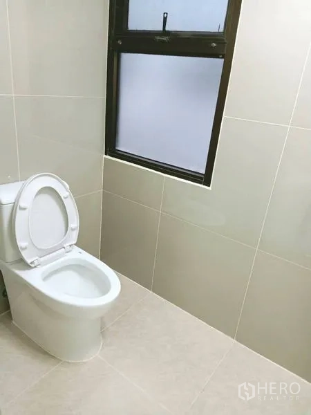 Condominium for  in Watthana, Bangkok - Guest toilet with window and light tile walls.