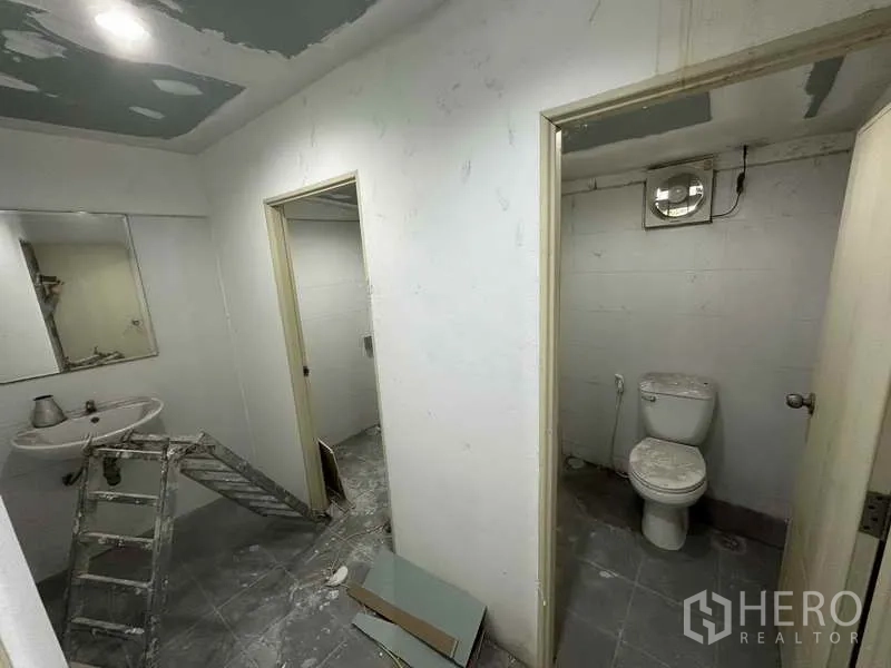 Home Office for rent in Bang Khen, Nonthaburi - Restroom block with separate toilet and washbasin undergoing refurbishment.