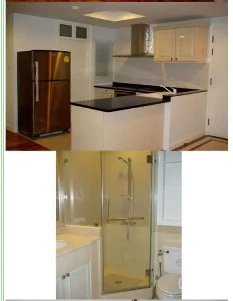 Condominium for rent or sale in Sathon, Bangkok - Modern U-shaped kitchen with black granite countertop and stainless refrigerator, plus a bathroom with glass shower and stone vanity.