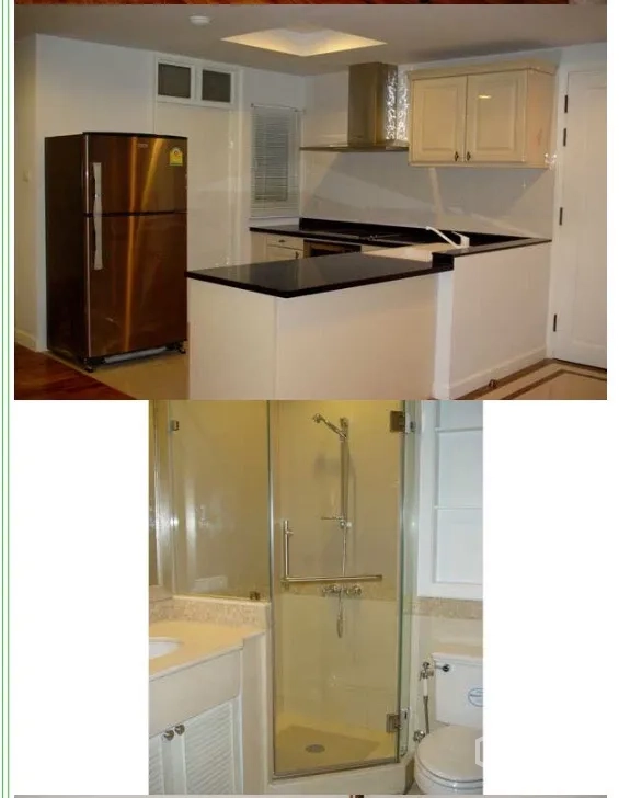 Condominium for rent or sale in Sathon, Bangkok - Modern U-shaped kitchen with black granite countertop and stainless refrigerator, plus a bathroom with glass shower and stone vanity.