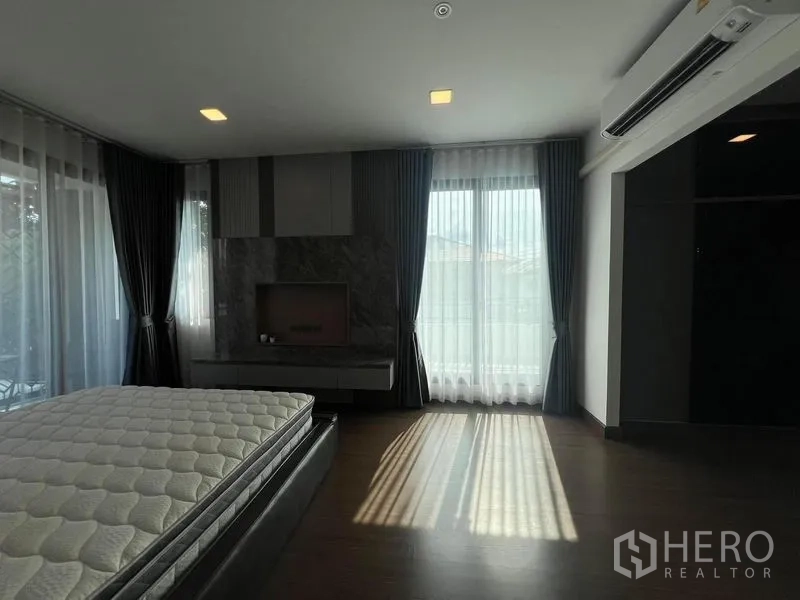 Detached House for rent or sale - Master suite with TV feature wall, large windows and sheer curtains.