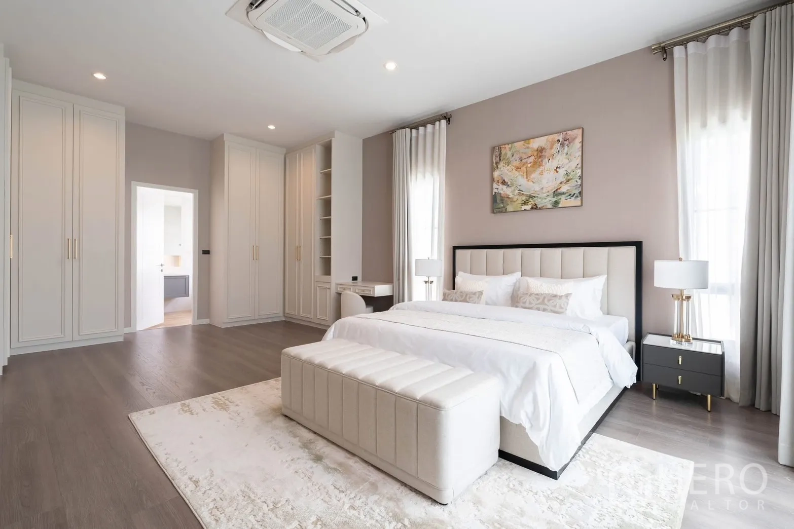 Detached House for rent in Bang Phli, Samut Prakan - Spacious master bedroom with built‑in wardrobes, study nook, and king bed.