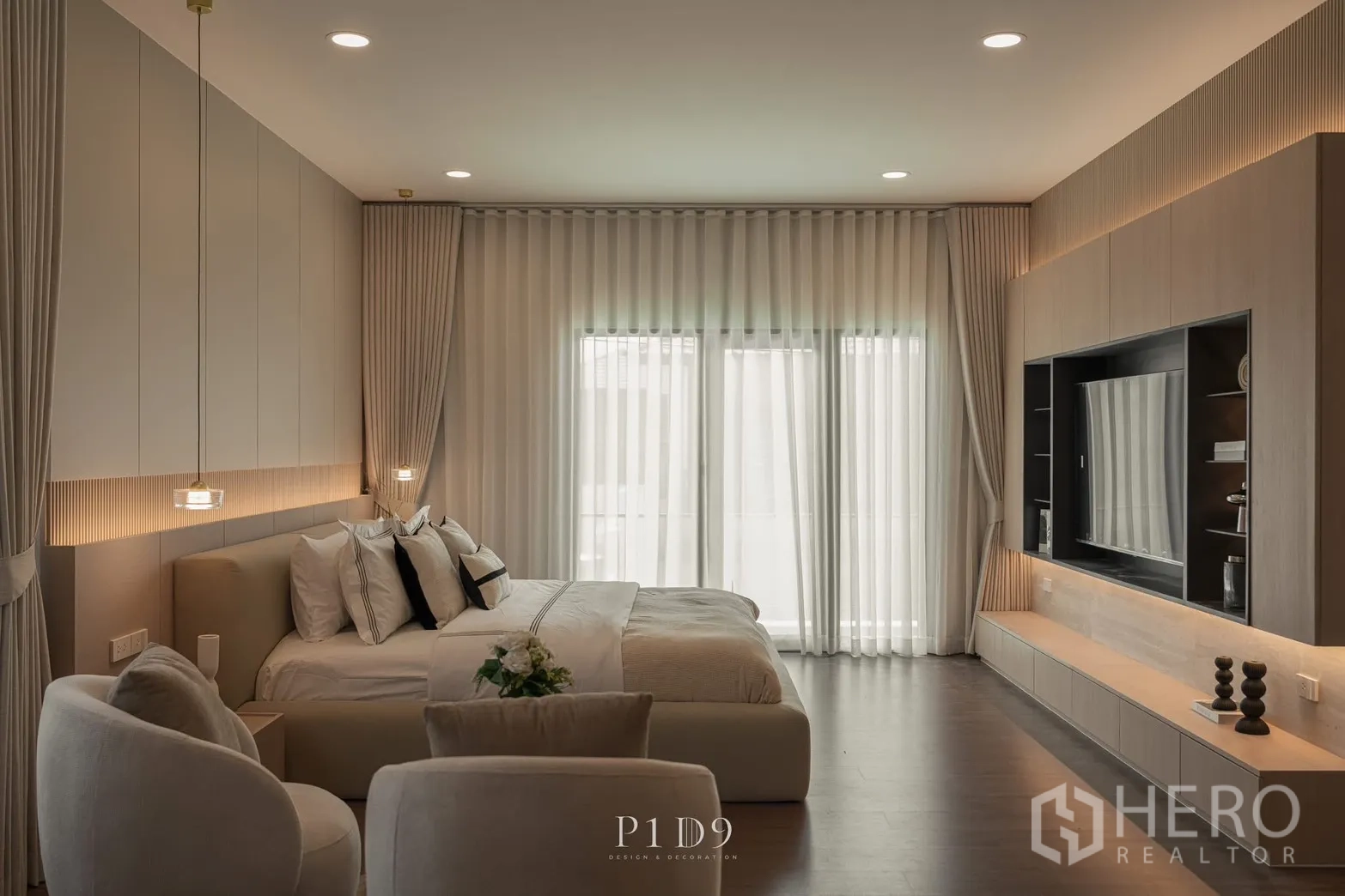 Detached House for rent in Bang Phli, Samut Prakan - Master bedroom with sliding glass doors, TV wall and layered drapes.