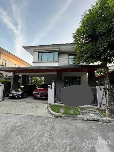 Detached House for sale in Bang Phli, Samut Prakan - Modern two-storey detached house facade with gated entrance and covered two-car carport
