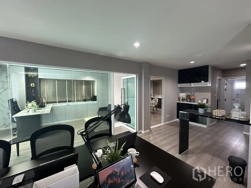 Factory for sale in Lam Luk Ka, Pathum Thani - Workstations facing a glass executive office and pantry area.