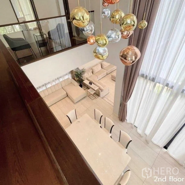 Detached House for rent in Bang Kapi, Bangkok - View from mezzanine over dining table and statement pendant lights.