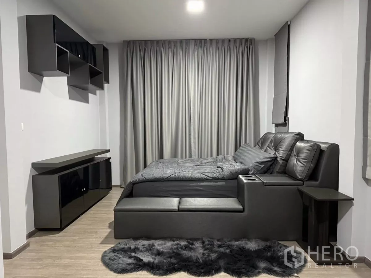 Detached House for rent in Bang Phli, Samut Prakan - Master bedroom featuring upholstered bed, wall cabinets and blackout curtains.