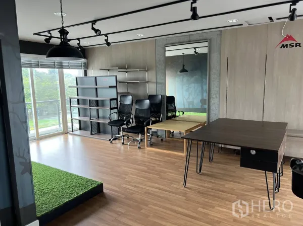 Detached House for rent or sale in Don Mueang, Bangkok - Office corner with shelving, task chairs and mirrored wall panels.