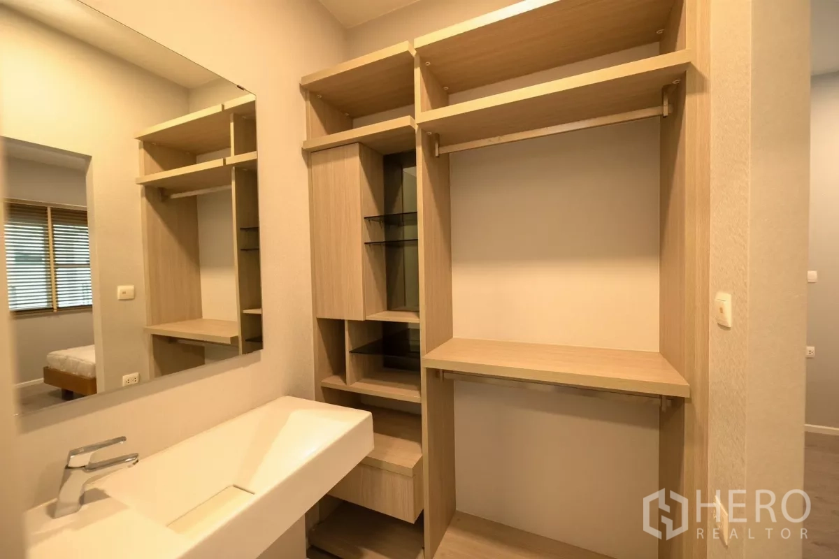 Detached House for rent or sale in Prawet, Bangkok - Bathroom with glass-enclosed rain shower and water heater.