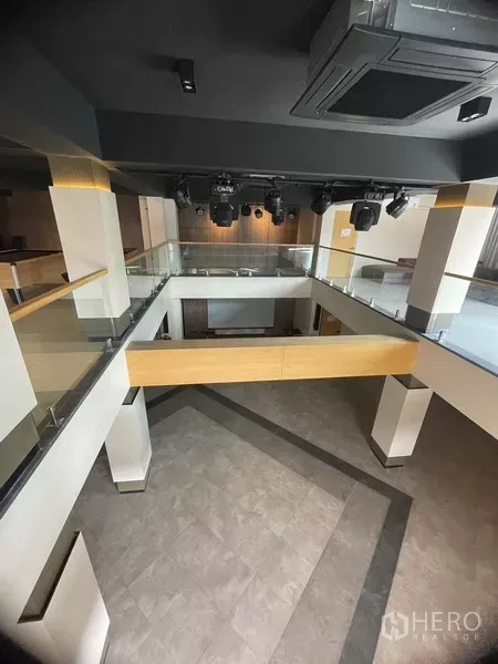 Office Space for rent or sale in Suan Luang, Bangkok - Double-height multipurpose hall with mezzanine walkways and stage lighting system.
