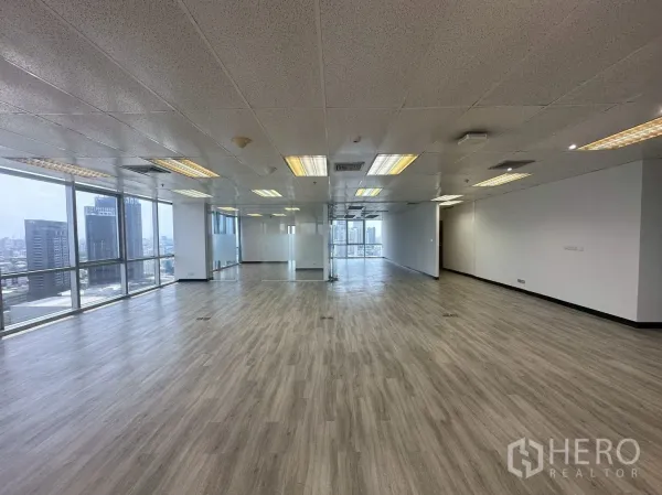 Office Space for rent - Bright open office area with a glass-walled meeting room and abundant natural light.