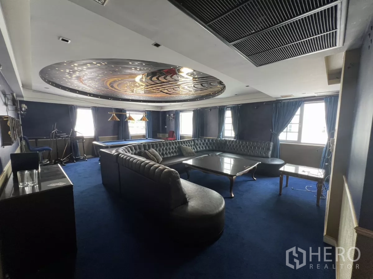 Retail Space for rent in Watthana, Bangkok - Blue-themed room with curved leather sectional, pool table and decorative ceiling lights.