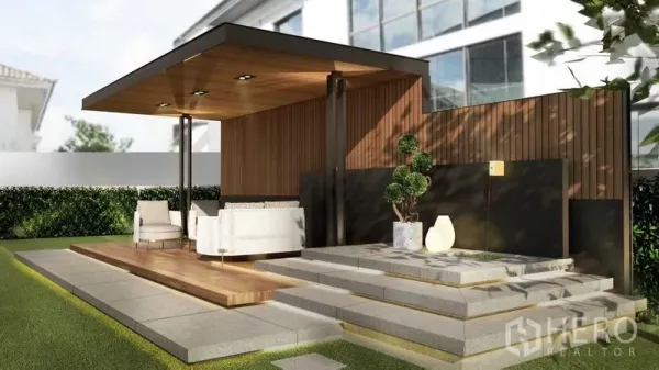 Detached House for sale in Prawet, Bangkok - Modern garden pavilion with wooden deck, tiered steps and manicured hedge on a private lawn.