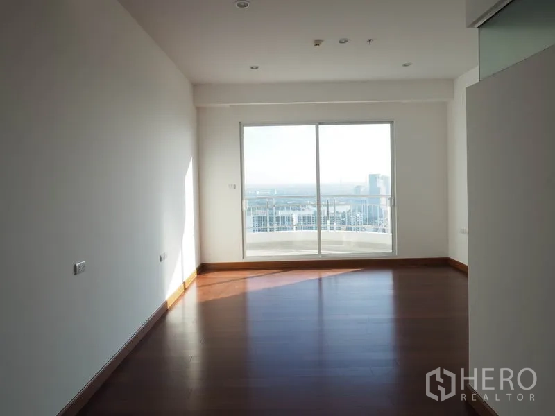 Condominium for rent or sale in Yan Nawa, Bangkok - Bright bedroom opening to a balcony with city skyline views.