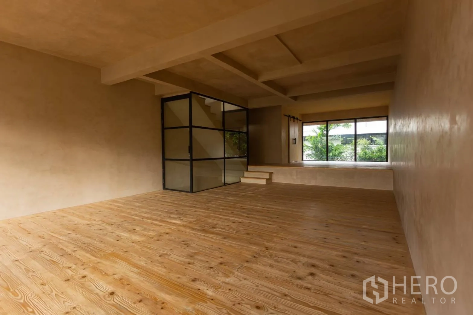 Home Office for rent in Watthana, Bangkok - Spacious studio area with timber flooring and glazed stair core.