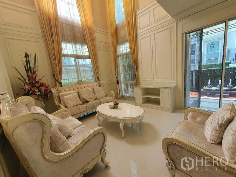 Detached House for rent in Bang Phli, Samut Prakan - Double-height lounge with tall windows and sliding glass doors