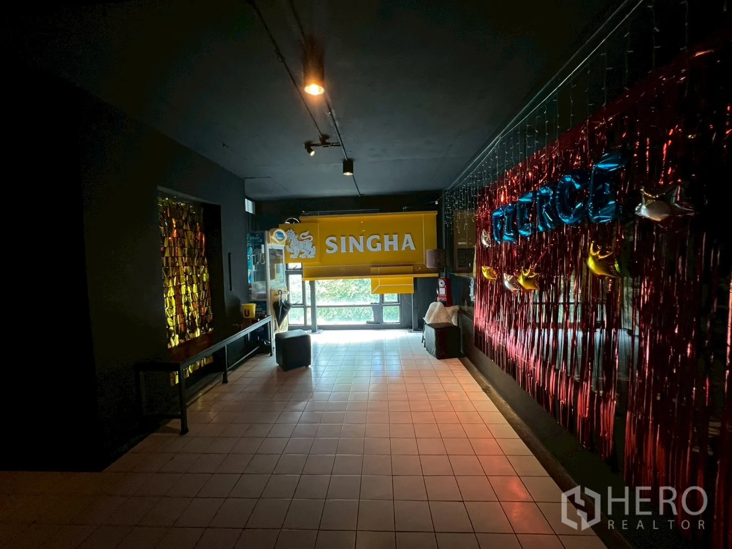 Shophouse for rent - Dim entrance corridor decorated for bar or event use.