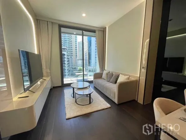 Condominium for rent - Living room facing balcony with city view and sleek built-in TV console.