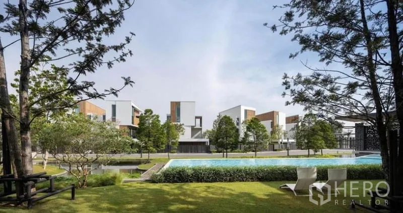 Detached House for rent in Saphan Sung, Bangkok - Landscaped community garden with long swimming pool and modern detached homes in a Bangkok estate