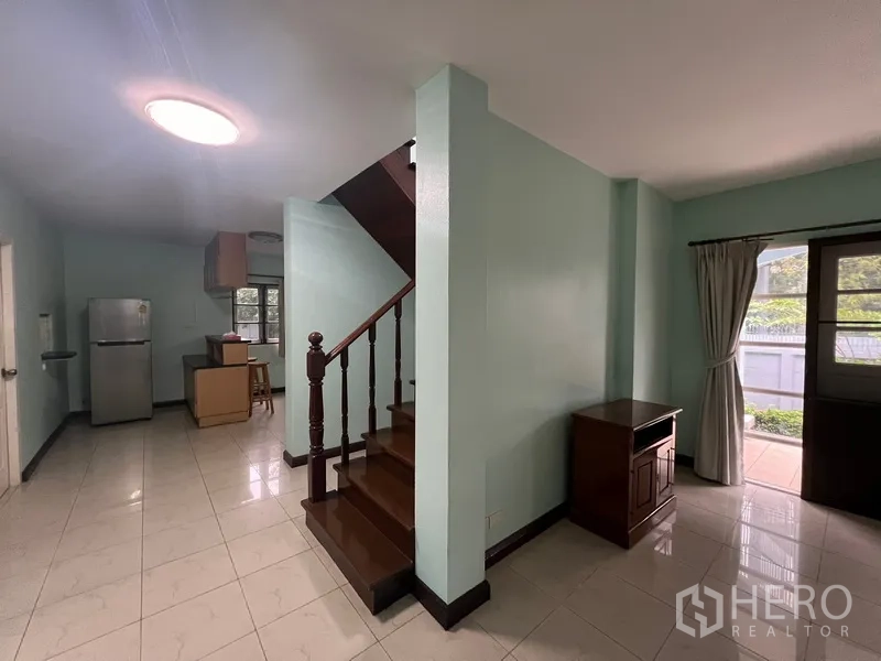 Detached House for rent in Bang Na, Bangkok - Ground floor view showing staircase, kitchen and patio doors