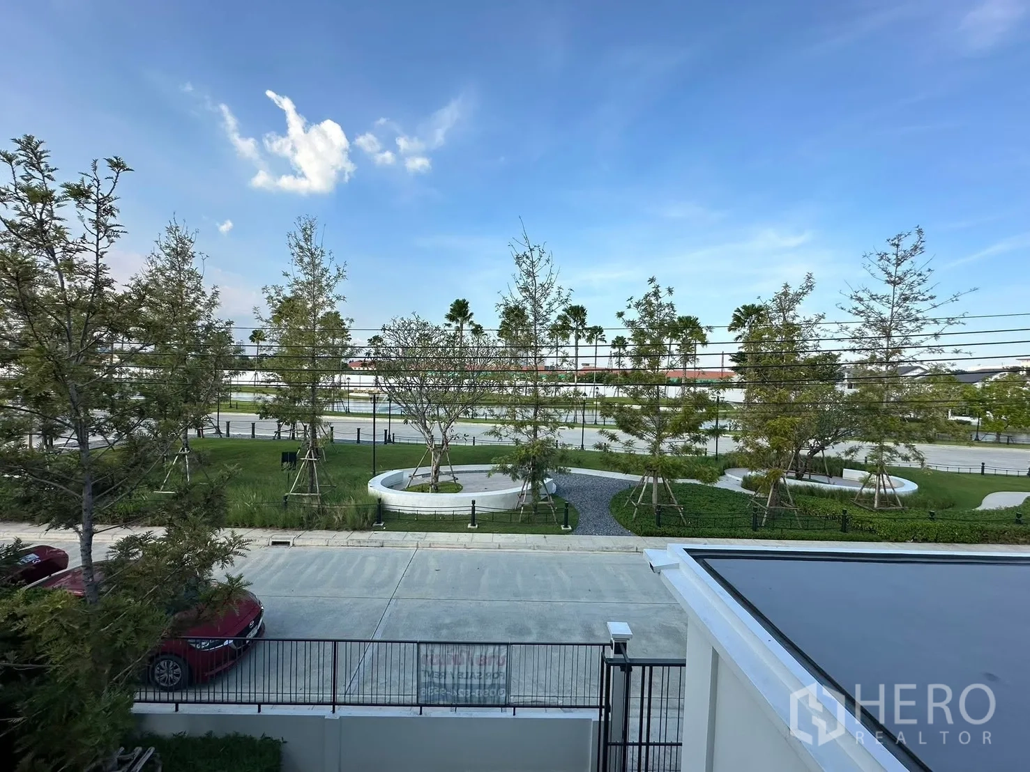 Detached House for rent in Bang Phli, Samut Prakan - Upper-floor view over driveway and central garden with pathways.