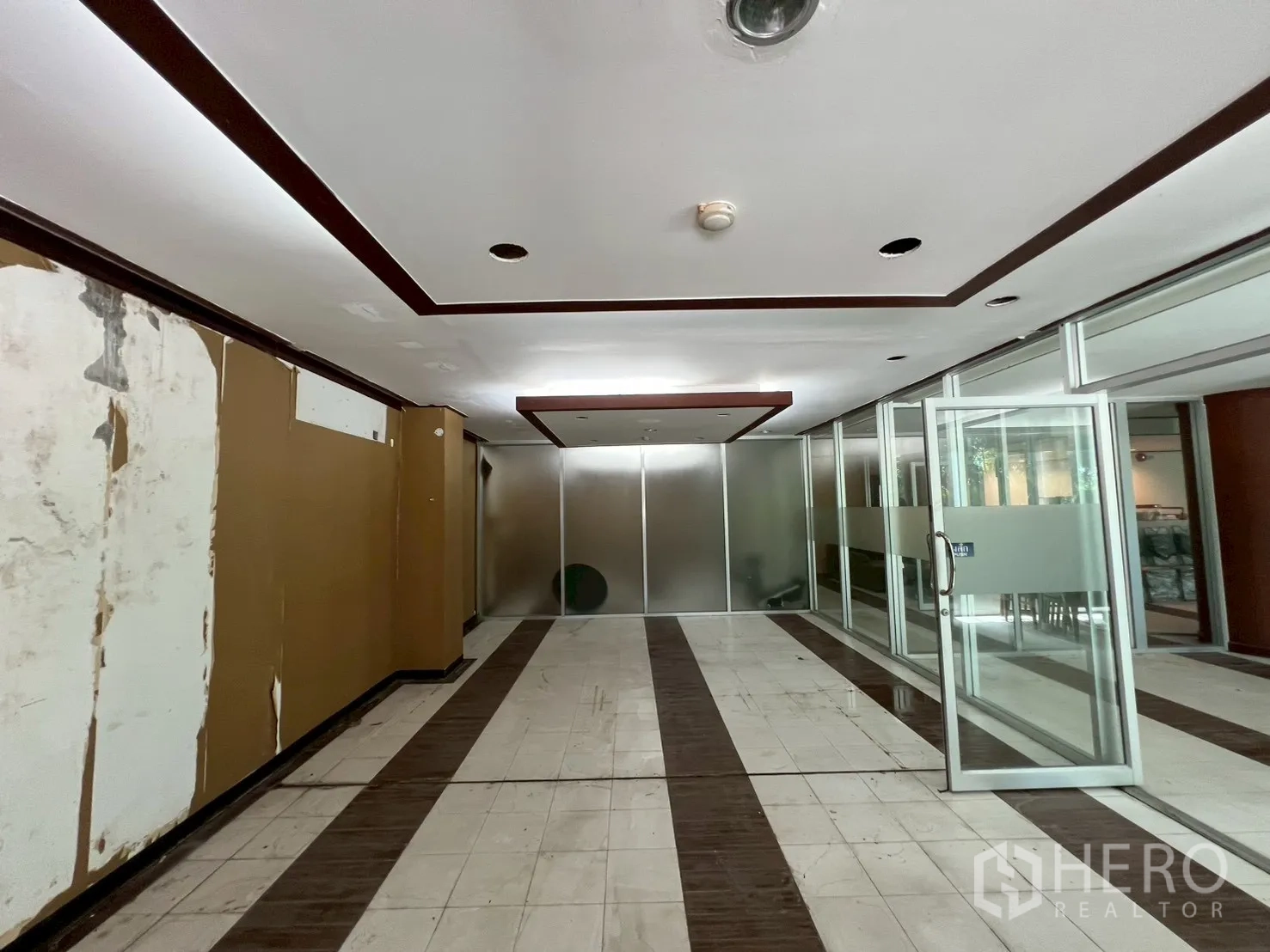 Shophouse for rent - Partitioned meeting area with frosted glass and recessed lighting.