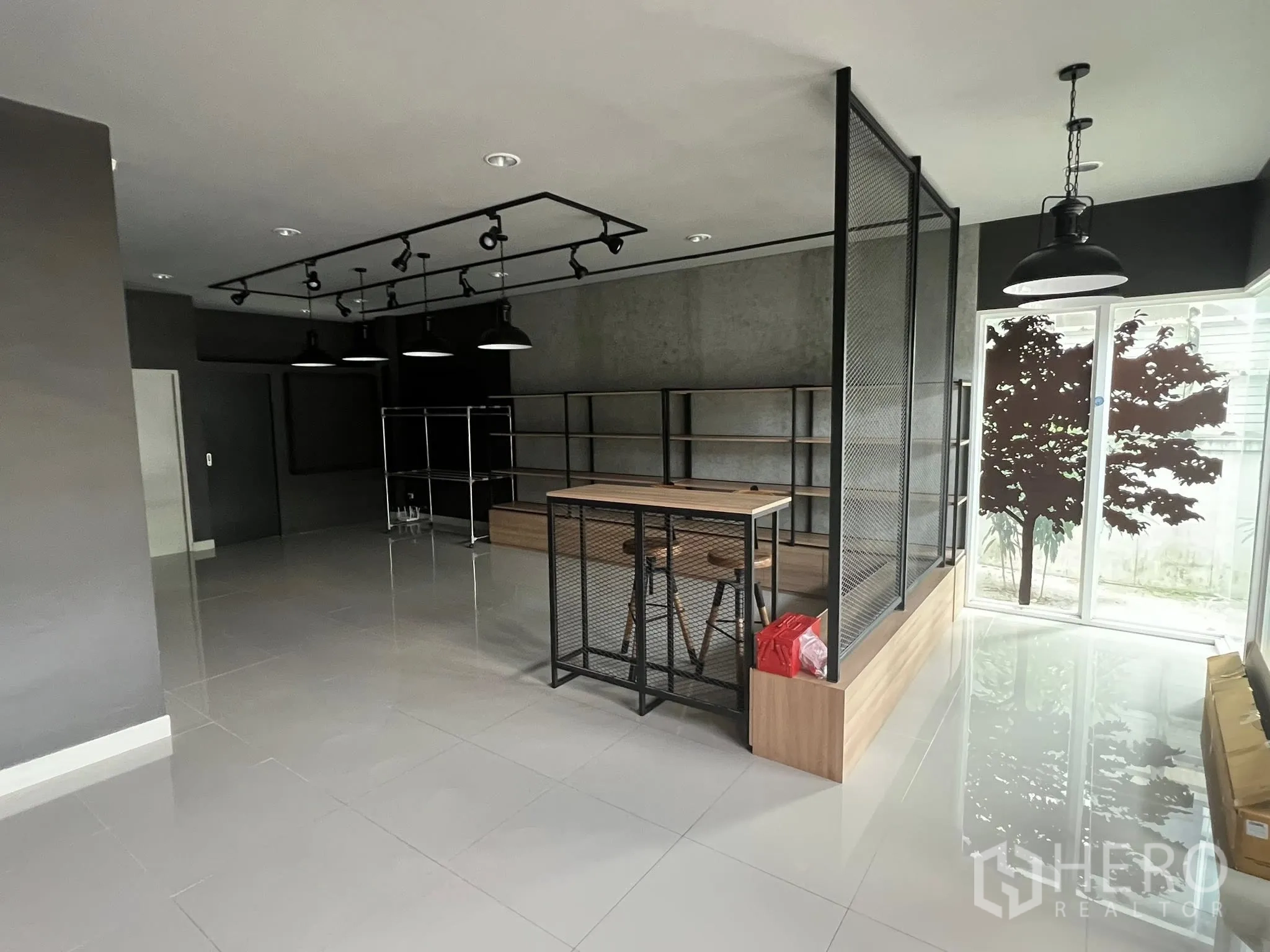Detached House for rent or sale in Don Mueang, Bangkok - Showroom with mesh partition, shelving and sliding glass doors.