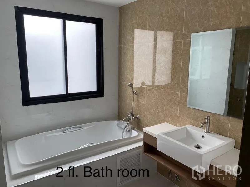 Home Office for rent or sale in Bang Phli, Samut Prakan - Upper-floor bathroom featuring bathtub, vanity and window for ventilation.
