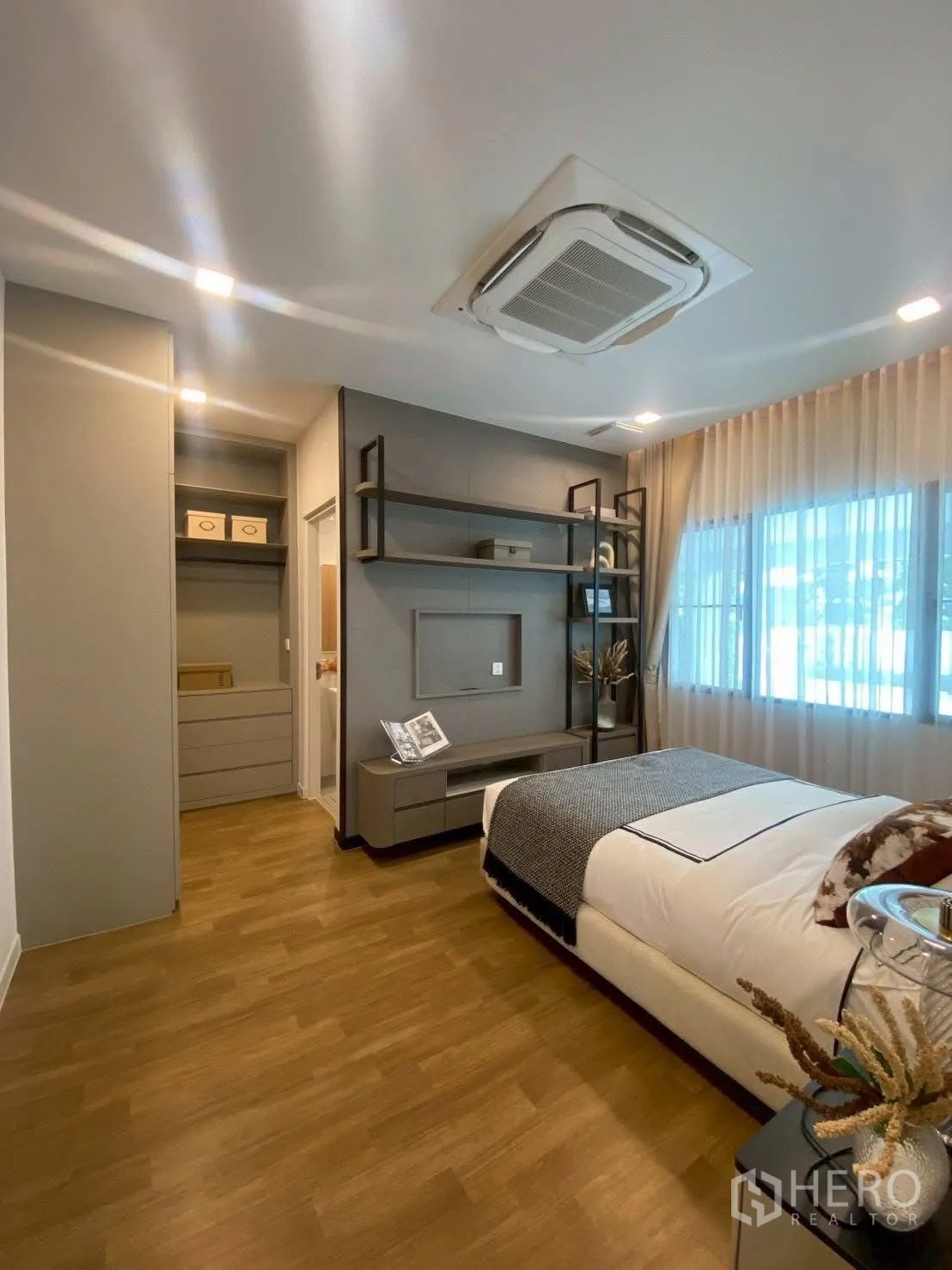 Detached House for rent in Bang Phli, Samut Prakan - Guest bedroom angle showing built-in storage and TV shelf.