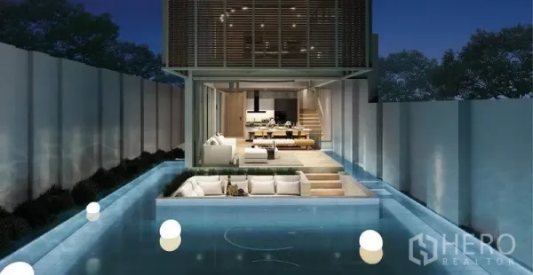 独立式住宅 出售在Lat Phrao, Bangkok - 开放式客餐厅衔接下沉会客区，四周环绕私家泳道。