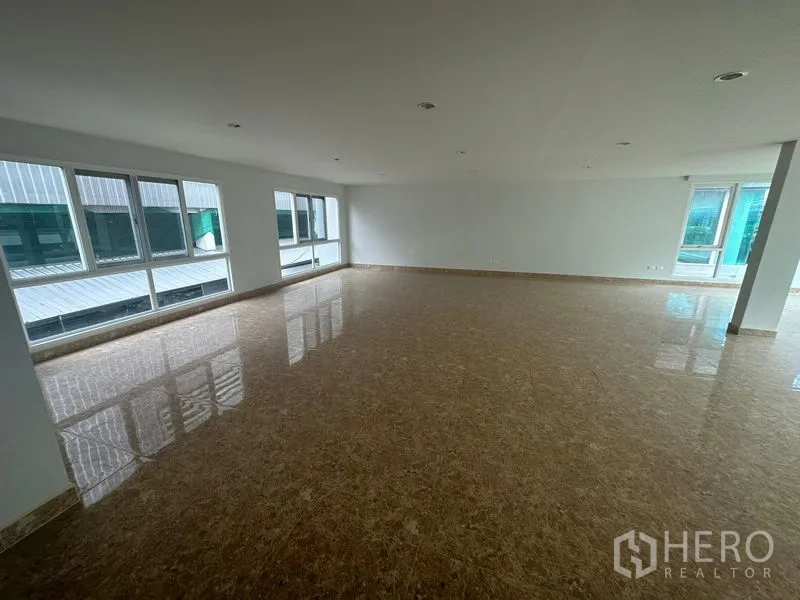 Home Office for rent in Bang Phli, Samut Prakan - Polished tile office area with multiple windows and natural light.