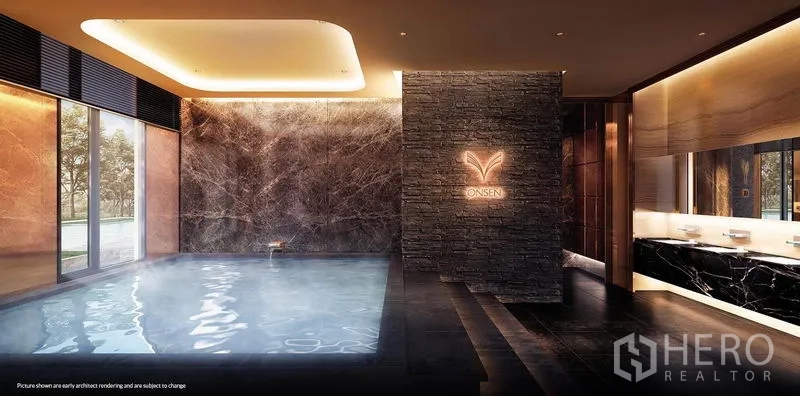 公寓 出租在Khlong Toei, Bangkok - 室内日式温泉风格水疗池，深色石材与暖光照明。