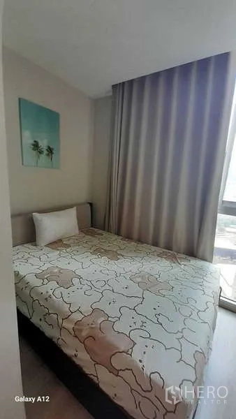 Condominium for rent - Second bedroom with single bed, floor-to-ceiling curtains and window