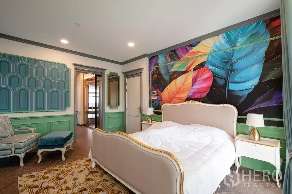 Detached House for rent or sale in Khlong Toei, Bangkok - Bedroom with bold leaf mural, mint paneling and classic furniture.