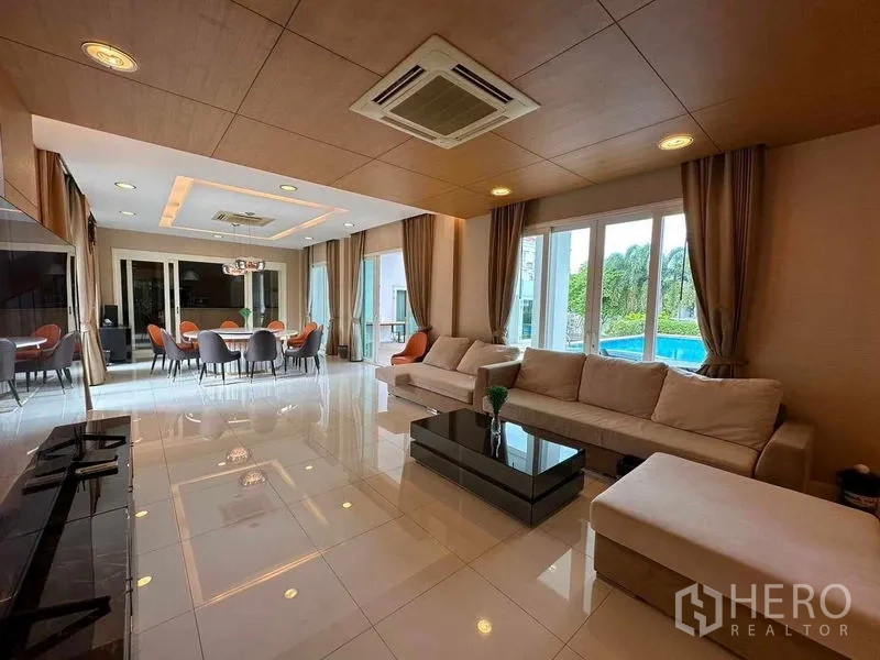 Detached House for rent or sale in Bang Phli, Samut Prakan - Open‑plan living and dining room with pool views through large windows