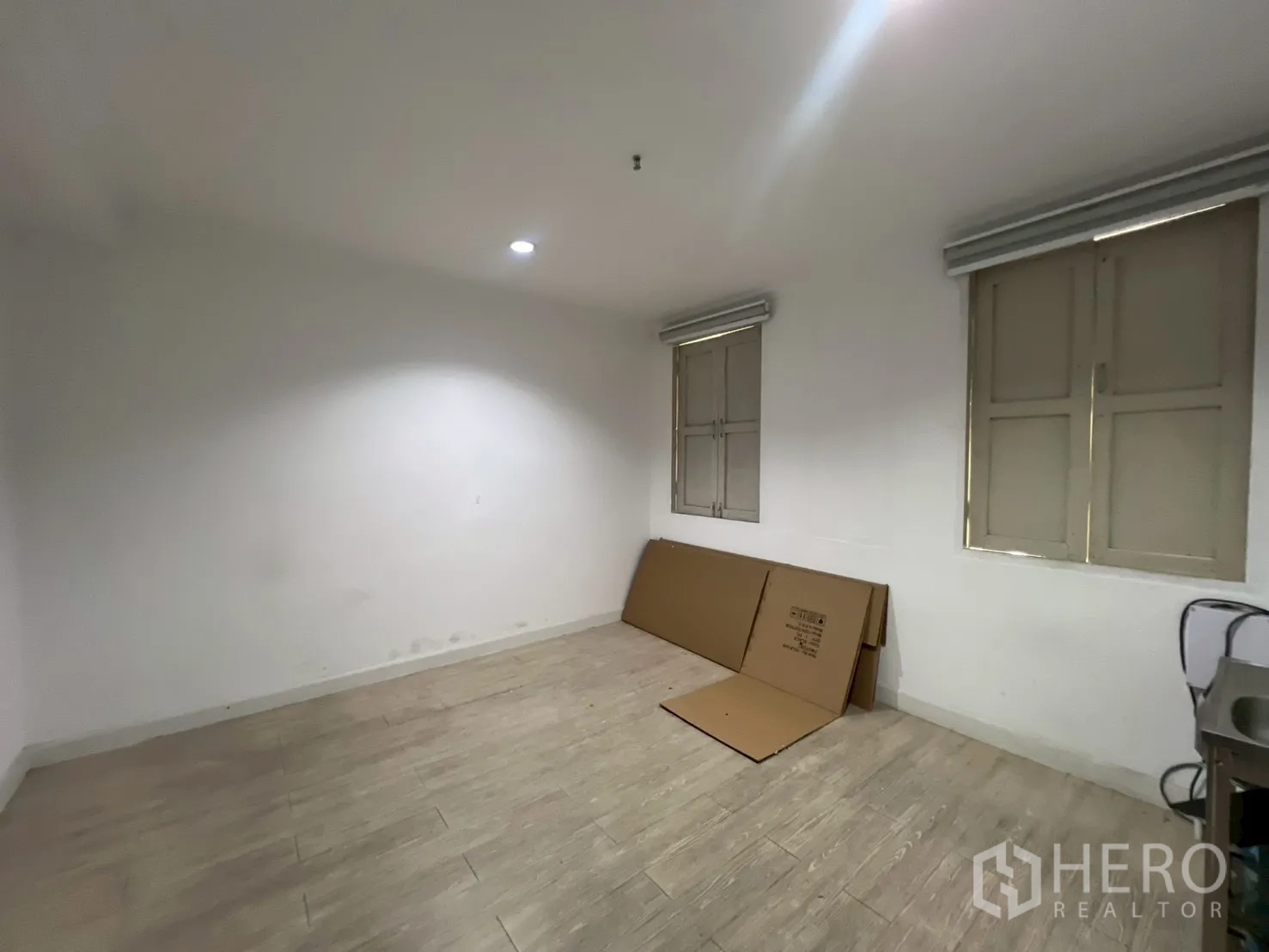 Office Space for rent in Watthana, Bangkok - Utility room with tiled floor, shuttered windows and a small stainless sink in the corner.