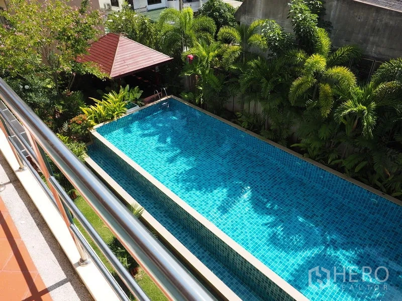 Home Office for sale in Phra Khanong, Bangkok - Aerial view of a long lap pool bordered by palms and a sala pavilion.