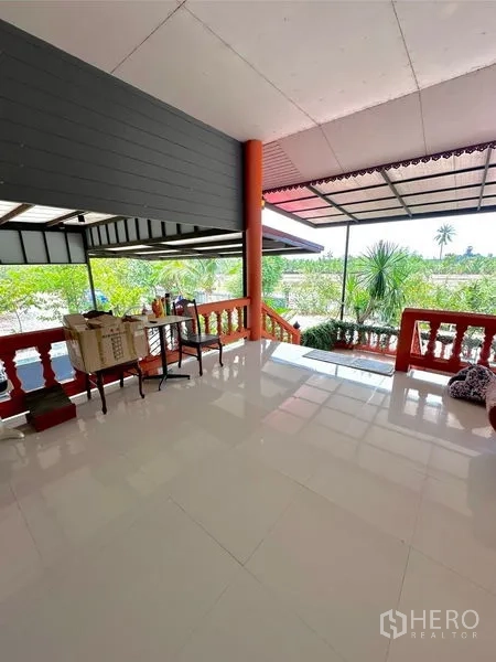 Detached House for sale in Bang Bua Thong, Nonthaburi - Upper balcony terrace with polished tiles and views over green surroundings.