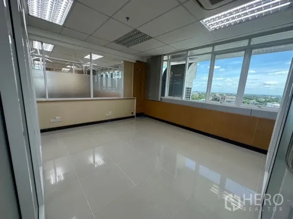 Office Space for rent in Suan Luang, Bangkok - Private corner office with wide windows offering Bangkok skyline views and abundant natural light.
