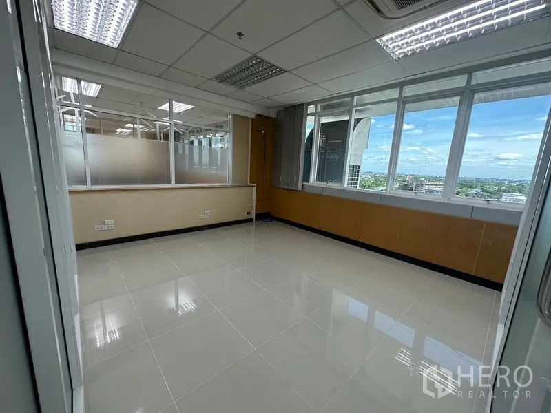 Office Space for rent in Suan Luang, Bangkok - Private corner office with wide windows offering Bangkok skyline views and abundant natural light.