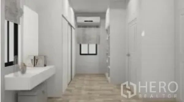 Detached House for rent or sale in Samut Prakan - Upstairs corridor with built-in wardrobes, vanity and wood floors leading to a window.