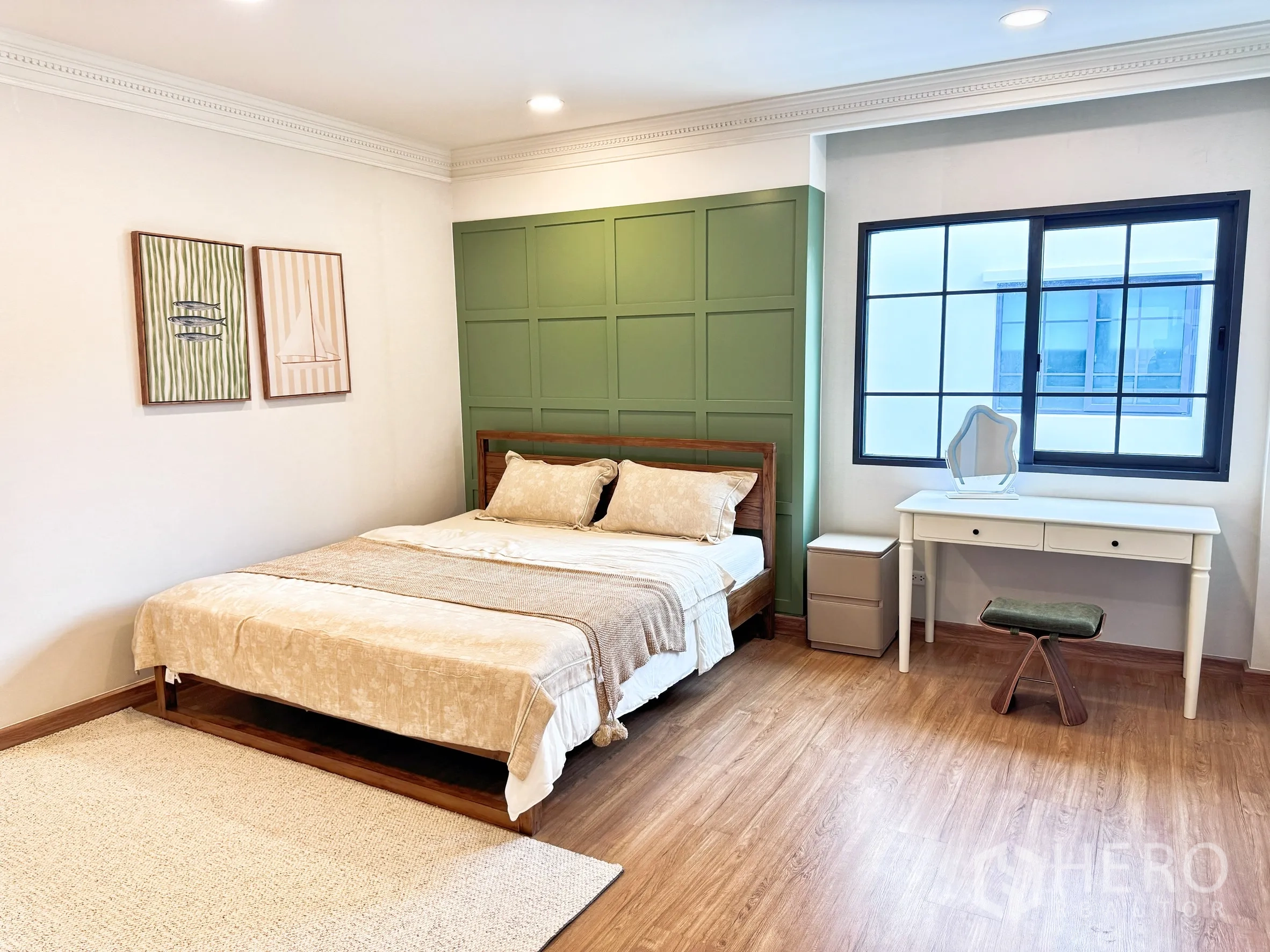 Detached House for rent in Bang Phli, Samut Prakan - Secondary bedroom with green accent wall, desk by window, and wood flooring.