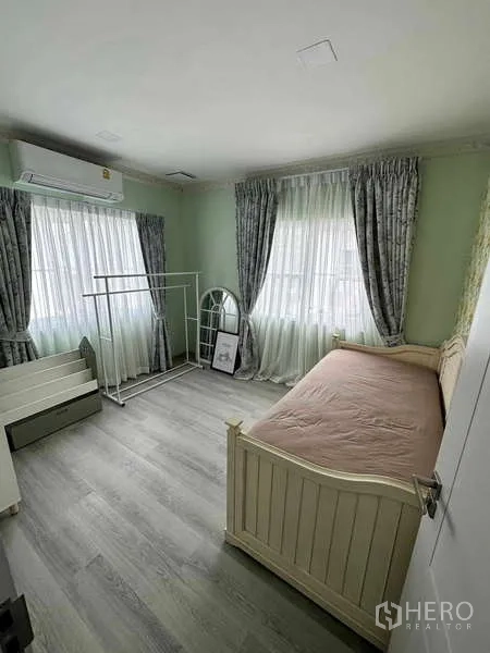 Detached House for sale in Bang Phli, Samut Prakan - Bright bedroom with single daybed, sheer curtains and vinyl wood flooring